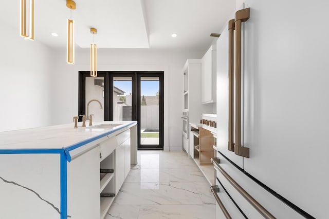 2607 Hoya Dr, Midland, TX 79707 - kitchen featuring high quality fridge, light marble finish floors, white cabinets, stainless steel oven, and recessed lighting