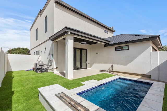 2607 Hoya Dr, Midland, TX 79707 - back of property featuring stucco siding, a fenced backyard, and a patio