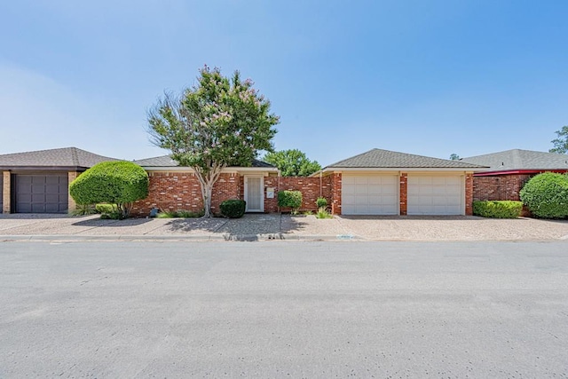 1007 Shirley Ln, Midland, TX 79705 - view of front of property featuring a garage and brick siding