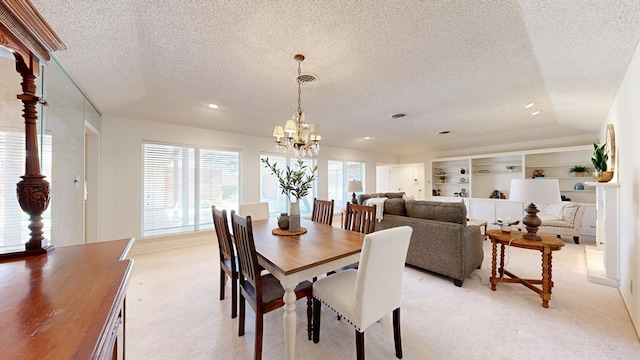 1007 Shirley Ln, Midland, TX 79705 - dining room featuring a textured ceiling, light colored carpet, a chandelier, and recessed lighting
