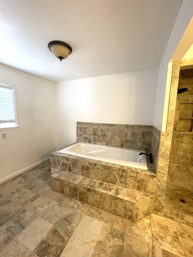 bathroom with tiled bath