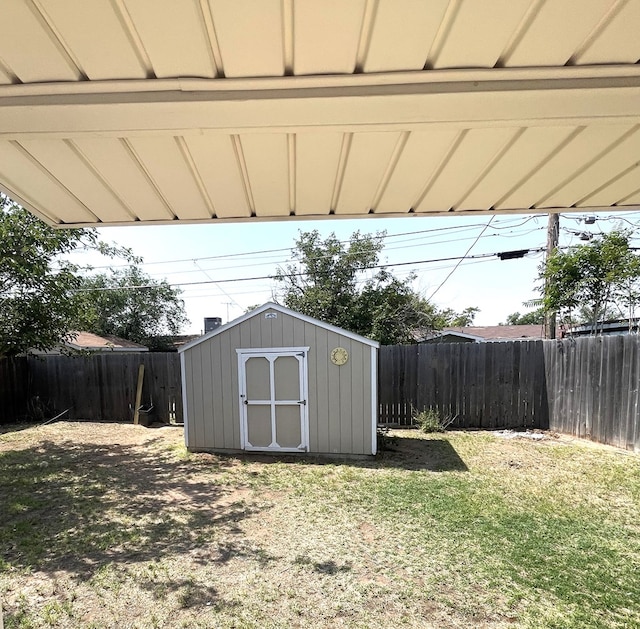 view of shed featuring a fenced backyard