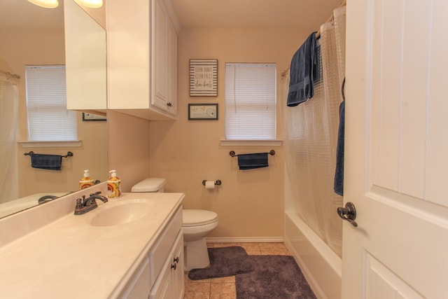 full bathroom featuring tile patterned flooring, shower / tub combo, vanity, and toilet