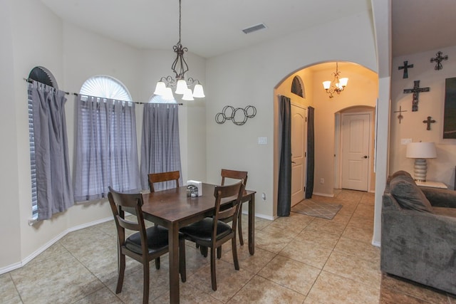 dining area featuring a notable chandelier and light tile patterned floors