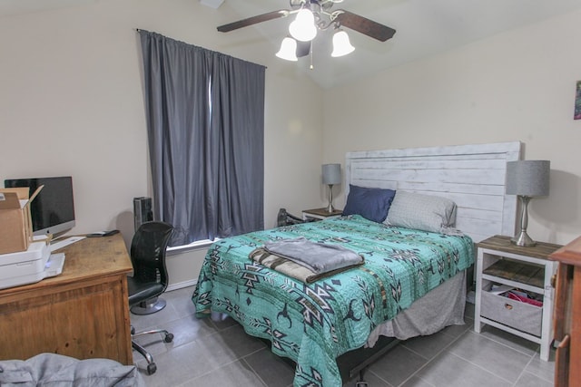 bedroom with tile patterned floors, ceiling fan, and lofted ceiling