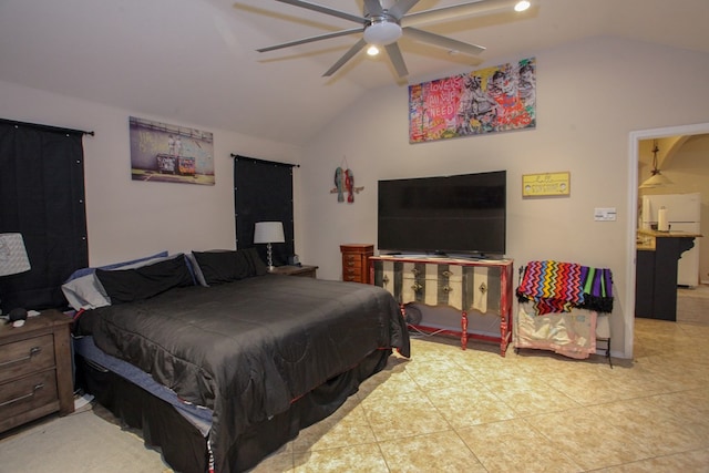 tiled bedroom with white refrigerator, vaulted ceiling, and ceiling fan