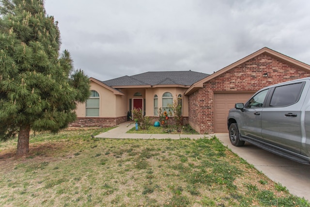 ranch-style home featuring a garage and a front yard