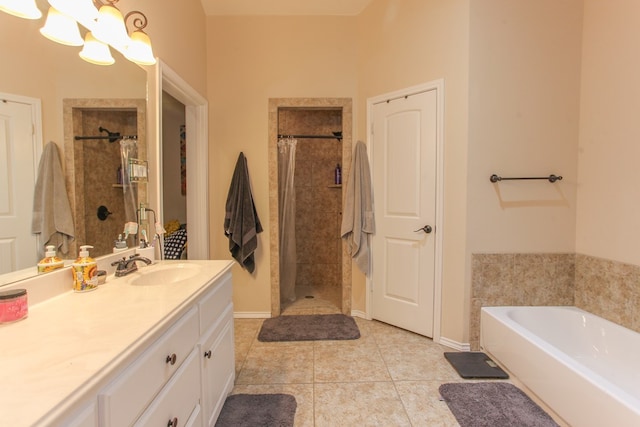 bathroom with plus walk in shower, vanity, and tile patterned floors