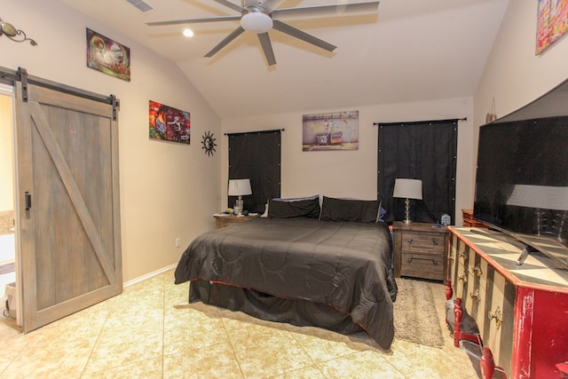 tiled bedroom with a barn door, ceiling fan, and lofted ceiling