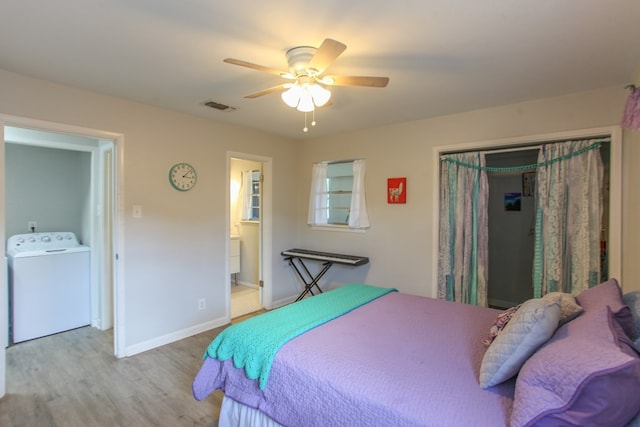 bedroom with a ceiling fan, baseboards, wood finished floors, visible vents, and a closet