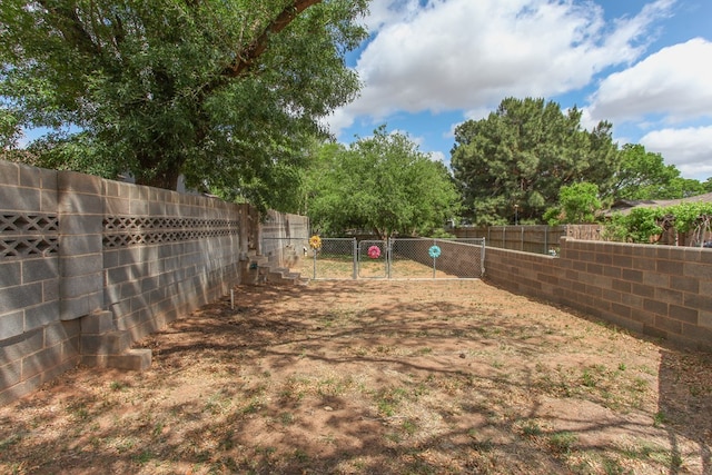 view of yard with a fenced backyard