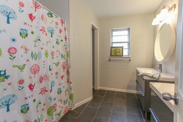 full bathroom featuring baseboards, a shower with shower curtain, tile patterned flooring, and vanity