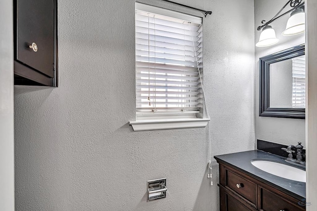 2821 Metz Dr, Midland, TX 79705 - bathroom with a textured wall and vanity