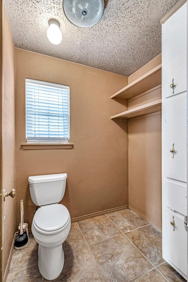 2821 Metz Dr, Midland, TX 79705 - bathroom with toilet and baseboards