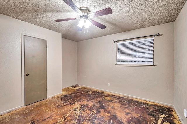 2821 Metz Dr, Midland, TX 79705 - spare room featuring a textured ceiling, ceiling fan, and baseboards