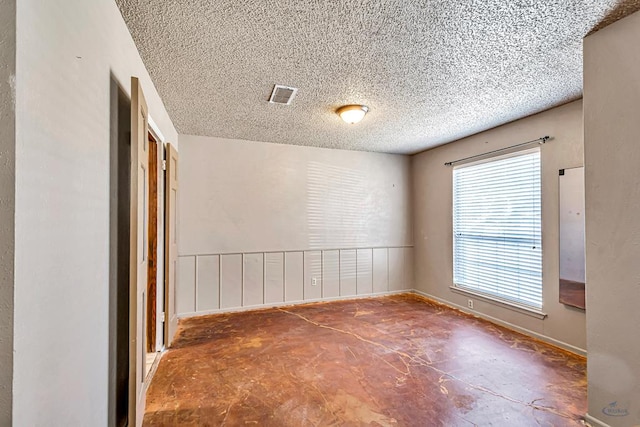 2821 Metz Dr, Midland, TX 79705 - empty room with a textured ceiling and baseboards