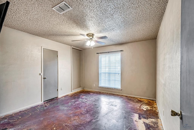 2821 Metz Dr, Midland, TX 79705 - empty room featuring a ceiling fan, a textured ceiling, and concrete floors