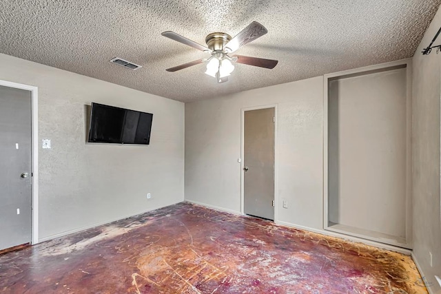 2821 Metz Dr, Midland, TX 79705 - unfurnished bedroom featuring a textured ceiling and a ceiling fan