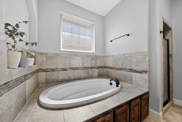 5514 Casa Grande Trl, Midland, TX 79707 - full bathroom with a tub with jets and a shower stall