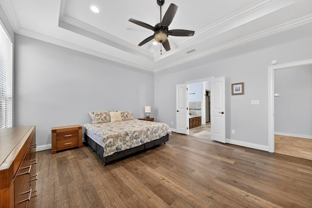 5514 Casa Grande Trl, Midland, TX 79707 - bedroom featuring a raised ceiling, ornamental molding, baseboards, and dark wood finished floors