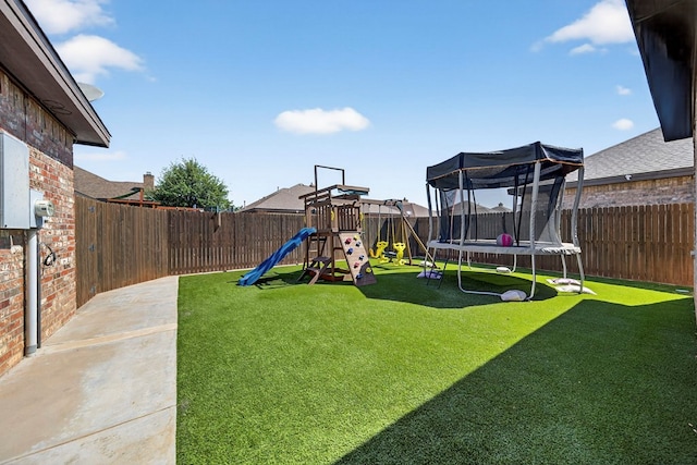 5514 Casa Grande Trl, Midland, TX 79707 - view of yard with a trampoline and a playground