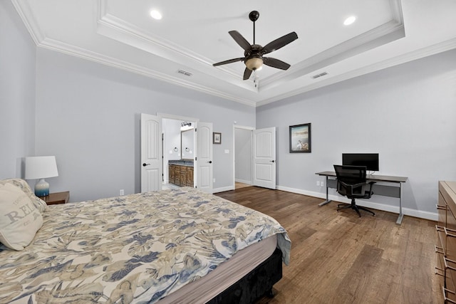 5514 Casa Grande Trl, Midland, TX 79707 - bedroom featuring a raised ceiling, dark wood-style flooring, crown molding, recessed lighting, and a desk