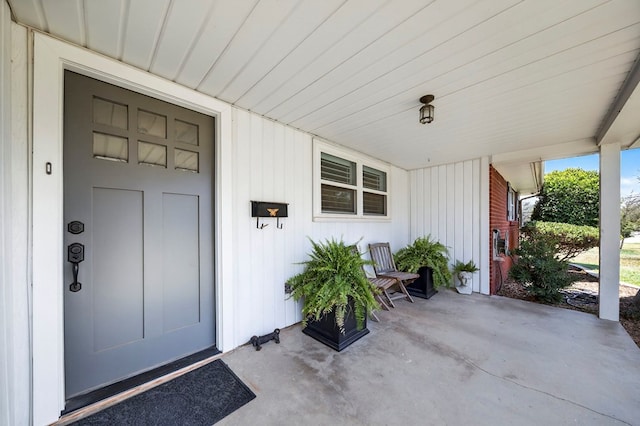 2802 Cimmaron Ave, Midland, TX 79705 - view of exterior entry featuring a porch and board and batten siding