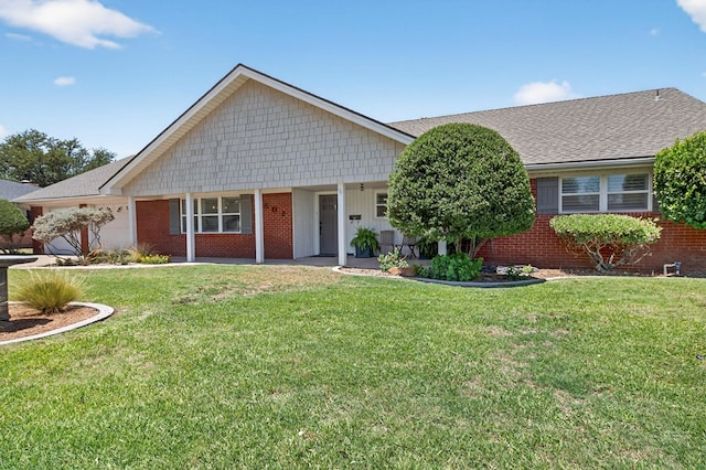 2802 Cimmaron Ave, Midland, TX 79705 - single story home featuring brick siding, a front lawn, a garage, and a shingled roof