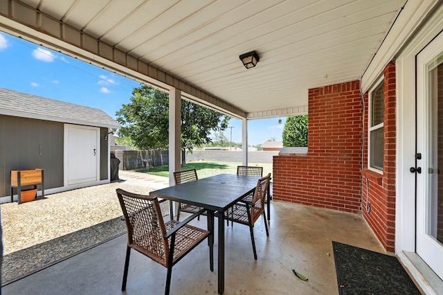 2802 Cimmaron Ave, Midland, TX 79705 - fenced backyard featuring outdoor dining space, a patio, and a storage shed