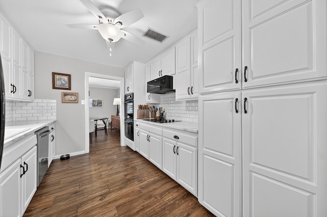 2802 Cimmaron Ave, Midland, TX 79705 - kitchen with black appliances, tasteful backsplash, dark wood finished floors, and white cabinetry