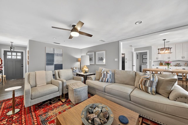 2802 Cimmaron Ave, Midland, TX 79705 - living room featuring wood finished floors and a ceiling fan