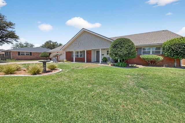 2802 Cimmaron Ave, Midland, TX 79705 - ranch-style house with brick siding and a front yard
