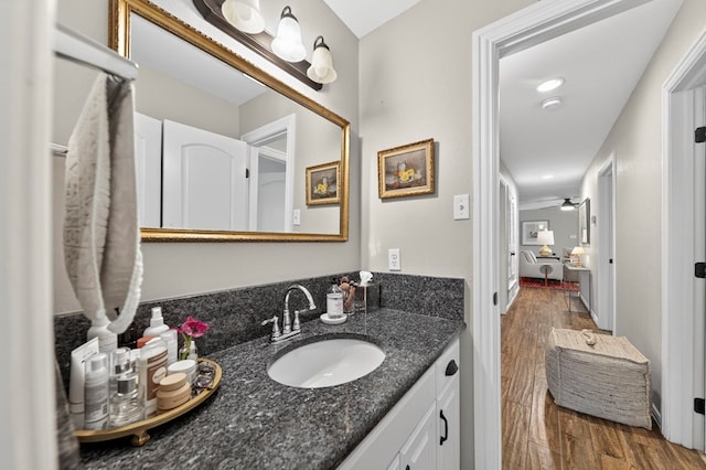 2802 Cimmaron Ave, Midland, TX 79705 - bathroom featuring wood finished floors and vanity
