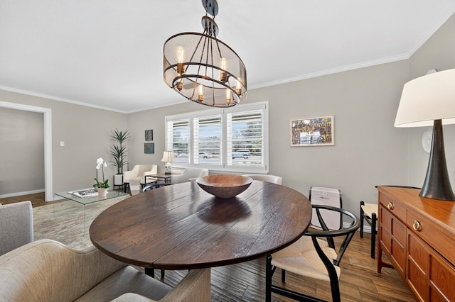 2802 Cimmaron Ave, Midland, TX 79705 - dining space featuring ornamental molding, wood finished floors, and a chandelier
