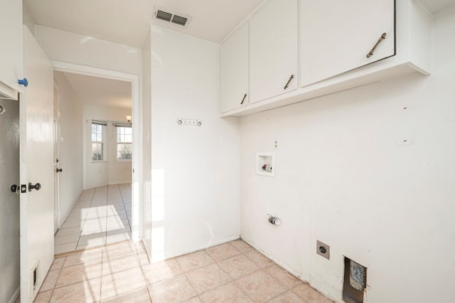 laundry area featuring washer hookup, cabinet space, visible vents, and hookup for an electric dryer