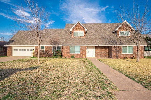 view of front of home with a garage, a front lawn, and brick siding