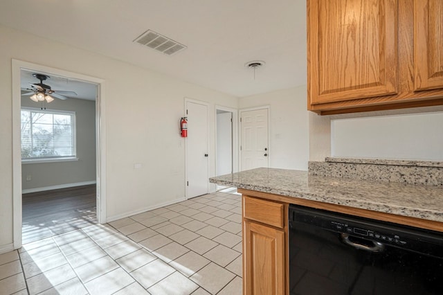 kitchen featuring light tile patterned floors, visible vents, light stone countertops, dishwasher, and baseboards