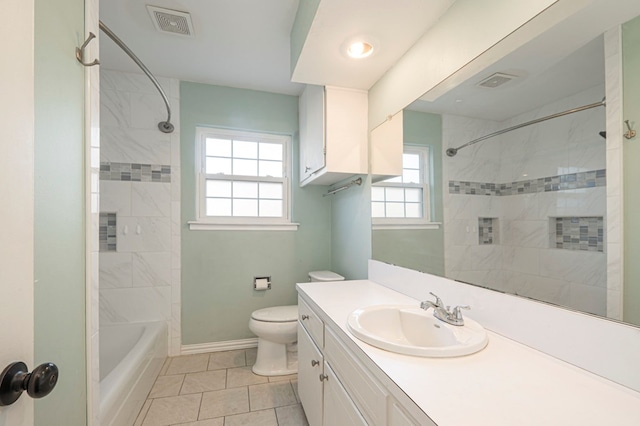 full bath featuring visible vents, vanity, toilet, and baseboards