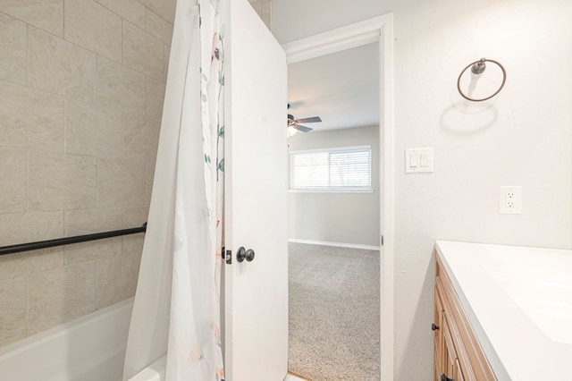 full bathroom featuring ceiling fan, shower / bath combination with curtain, vanity, and baseboards