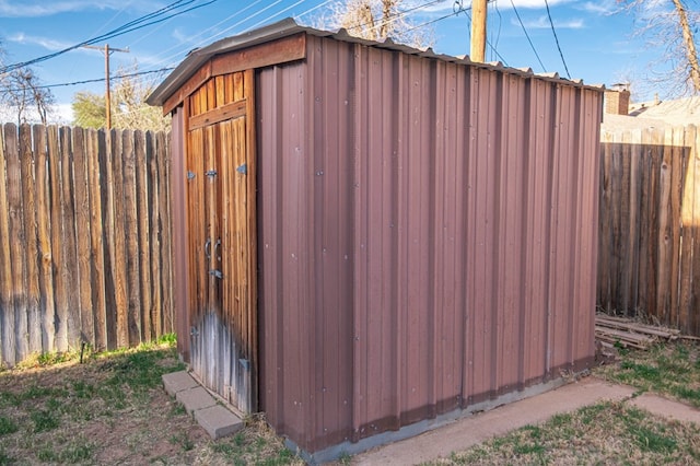 view of shed featuring a fenced backyard