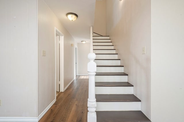 stairs with wood finished floors