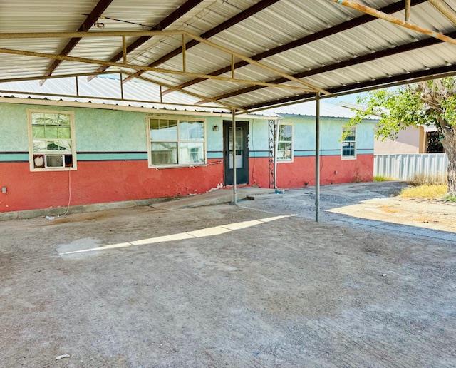 view of vehicle parking featuring a carport