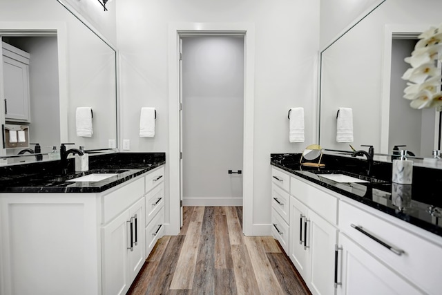 bathroom with hardwood / wood-style floors and vanity