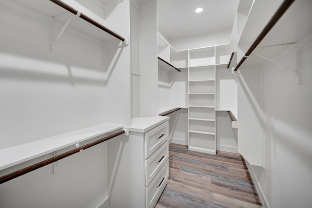 walk in closet featuring light hardwood / wood-style flooring