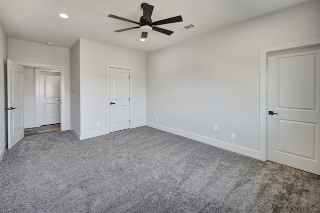 unfurnished bedroom featuring carpet and ceiling fan