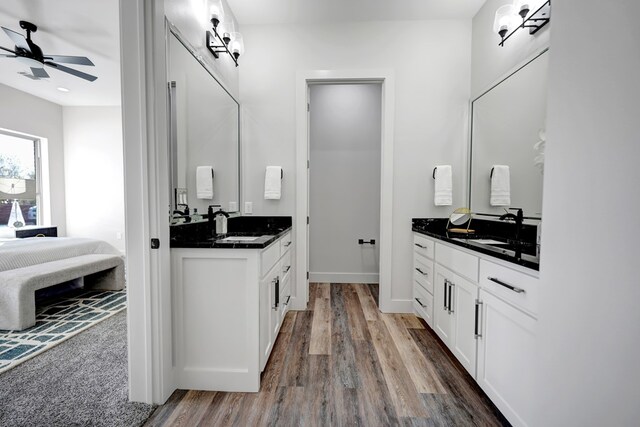 bathroom featuring hardwood / wood-style flooring, ceiling fan, and vanity