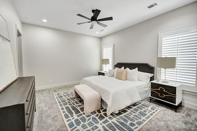 bedroom featuring light carpet and ceiling fan