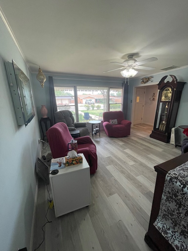 2804 33rd St, Snyder, TX 79549 - living room featuring wood finished floors, ornamental molding, and ceiling fan