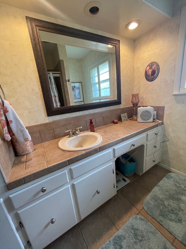 2804 33rd St, Snyder, TX 79549 - bathroom with vanity, tile patterned flooring, and a shower stall