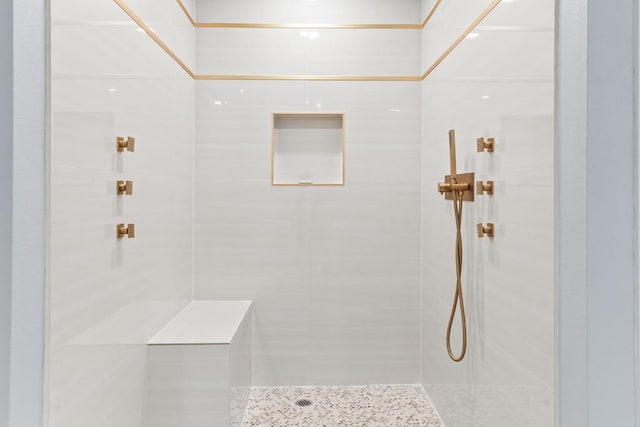 bathroom with tiled shower